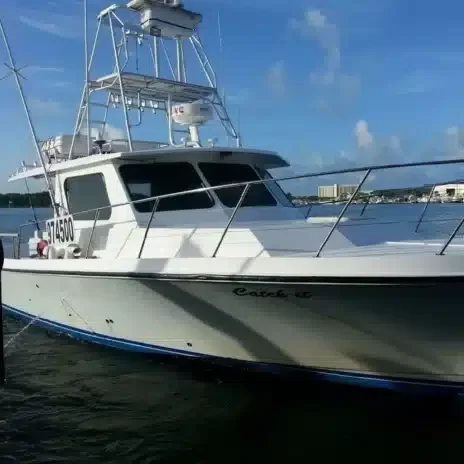 Catch It Fishing Charters & Tours 40′ custom built boat | Young boy holding fresh caught fish from a deep sea fishing tour | Catch It Fishing Charters & Tours in Panama City Beach offers family friendly, deep sea fishing trips ranging from 3 hours to 12 hours, and dolphin tours and sightseeing boat tours along the Gulf Coast.