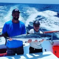Catch It Fishing Charters & Tours Gallery Image of father & son holding fresh caught fish from a fishing trip in PCB | Catch It Fishing Charters & Tours in Panama City Beach offers family friendly, deep sea fishing trips ranging from 3 hours to 12 hours, and dolphin tours and sightseeing boat tours along the Gulf Coast.