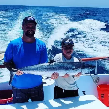 Catch It Fishing Charters & Tours Gallery Image of father & son holding fresh caught fish from a fishing trip in PCB | Catch It Fishing Charters & Tours in Panama City Beach offers family friendly, deep sea fishing trips ranging from 3 hours to 12 hours, and dolphin tours and sightseeing boat tours along the Gulf Coast.